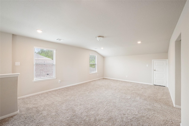 104 Clay Creek Ln, Montgomery, TX 77316 - carpeted spare room with healthy amount of natural light, baseboards, lofted ceiling, and recessed lighting