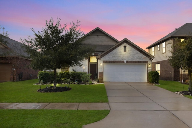 7923 Cheyenne Hills Trl, Richmond, TX 77406 - view of front of home with an attached garage, driveway, a front lawn, and brick siding