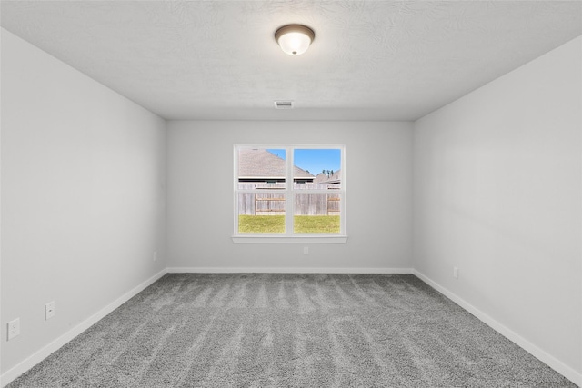 3017 Pampaneria Dr, Conroe, TX 77301 - empty room featuring carpet floors, baseboards, and a textured ceiling