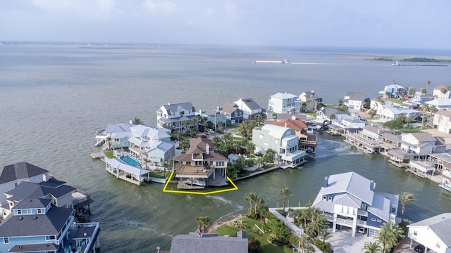 aerial view of residential area with a nearby body of water