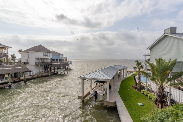 dock featuring boat lift and a water view