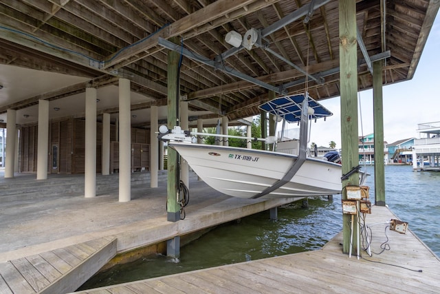 dock featuring a water view and boat lift