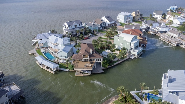 aerial perspective of suburban area with a large body of water
