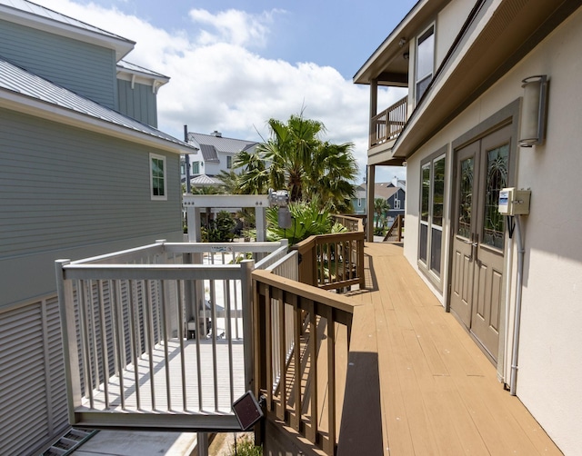 wooden deck featuring french doors