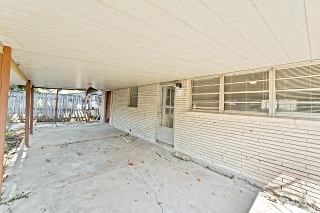 view of patio / terrace featuring fence