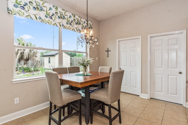 1886 Pampas Trail Dr, Friendswood, TX 77546 - dining room with a chandelier, light tile patterned flooring, and baseboards