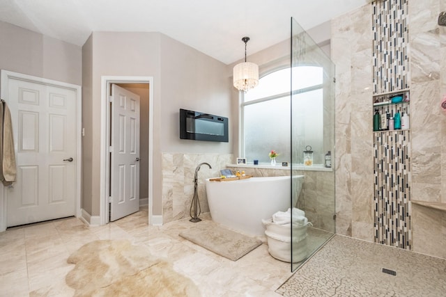 1886 Pampas Trail Dr, Friendswood, TX 77546 - full bath with a freestanding bath, walk in shower, a chandelier, tile walls, and marble finish flooring
