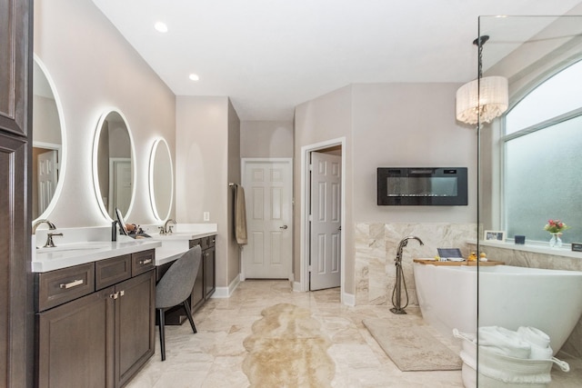 1886 Pampas Trail Dr, Friendswood, TX 77546 - full bath featuring double vanity, a soaking tub, and marble look tile flooring