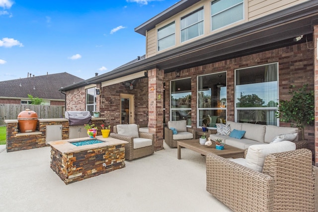 1886 Pampas Trail Dr, Friendswood, TX 77546 - view of patio with an outdoor living space with a fire pit