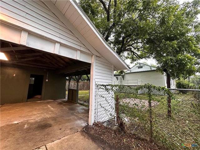 view of home's exterior with fence