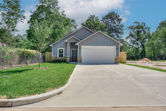 ranch-style home with a garage, board and batten siding, concrete driveway, and stone siding