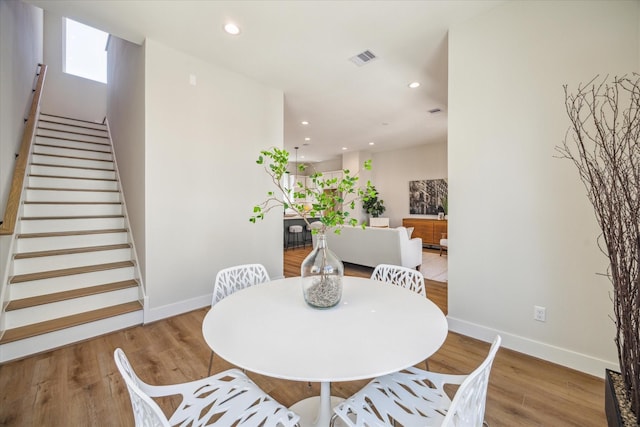 526 Janisch Rd, Houston, TX 77018 - dining room featuring baseboards, stairs, recessed lighting, and wood finished floors