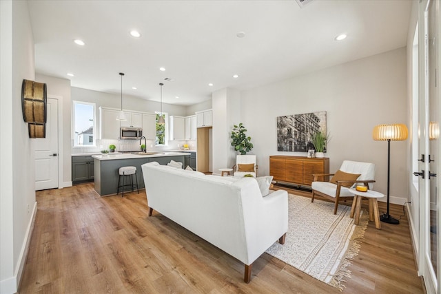 526 Janisch Rd, Houston, TX 77018 - living area with recessed lighting, light wood finished floors, and baseboards