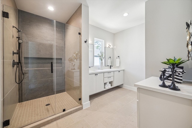 526 Janisch Rd, Houston, TX 77018 - bathroom featuring a shower stall, vanity, baseboards, and recessed lighting