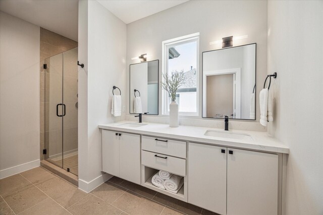 526 Janisch Rd, Houston, TX 77018 - bathroom featuring a shower stall, double vanity, baseboards, and tile patterned flooring