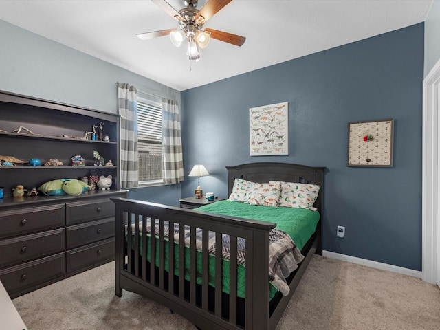 bedroom with carpet, a ceiling fan, and baseboards