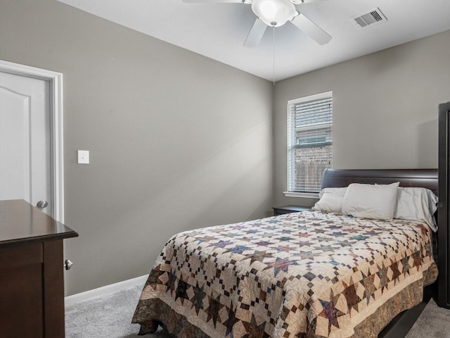carpeted bedroom featuring baseboards and ceiling fan