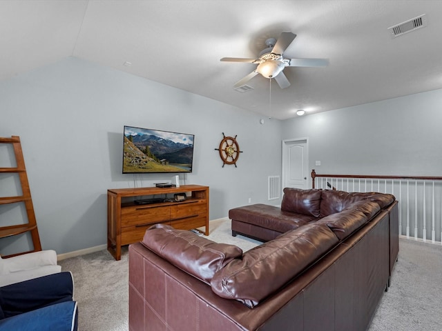 living room with light carpet, ceiling fan, lofted ceiling, and baseboards