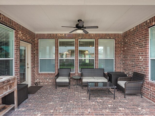 view of patio / terrace with a ceiling fan and an outdoor living space
