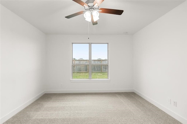 15222 Prairie Mill Dr, New Caney, TX 77357 - empty room with baseboards, light colored carpet, and a ceiling fan