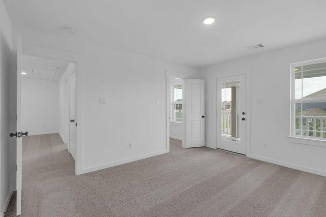 8235 Red Shiner Way, Fulshear, TX 77441 - spare room featuring attic access, carpet floors, recessed lighting, and a smoke detector