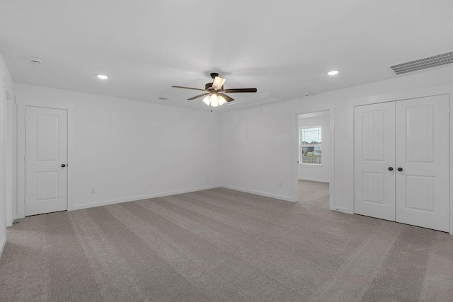 8235 Red Shiner Way, Fulshear, TX 77441 - unfurnished bedroom featuring recessed lighting, attic access, carpet flooring, ceiling fan, and a closet