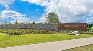 8235 Red Shiner Way, Fulshear, TX 77441 - community / neighborhood sign featuring a lawn