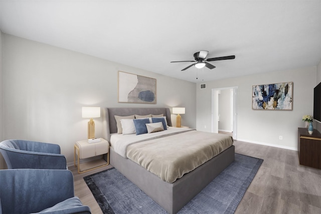 3915 Glenheather Dr, Houston, TX 77068 - bedroom with wood finished floors, baseboards, and a ceiling fan