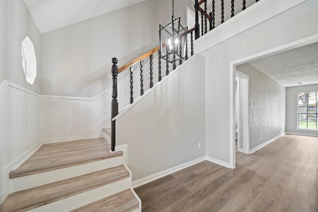 3915 Glenheather Dr, Houston, TX 77068 - stairway with wood finished floors, baseboards, and a chandelier