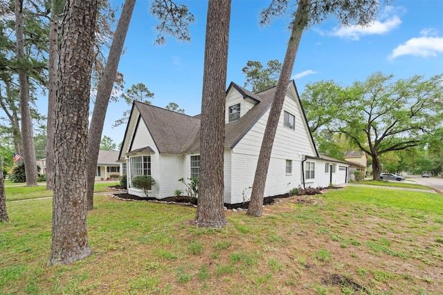3915 Glenheather Dr, Houston, TX 77068 - view of home's exterior featuring a yard, roof with shingles, and brick siding