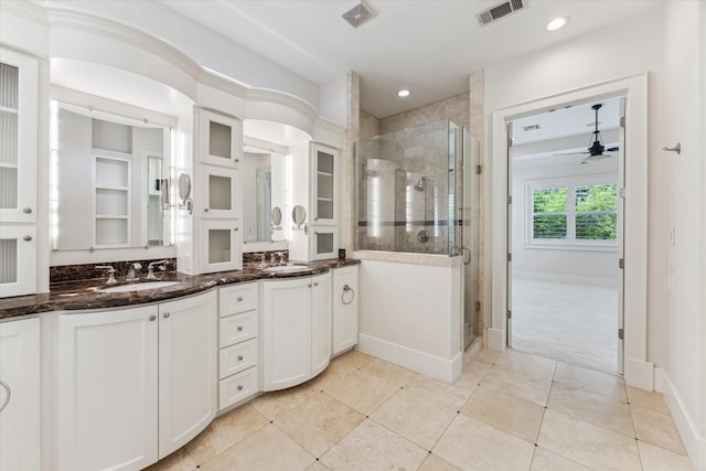 6216 Queenswood Ln, Houston, TX 77008 - bathroom with a stall shower, tile patterned flooring, double vanity, ceiling fan, and recessed lighting