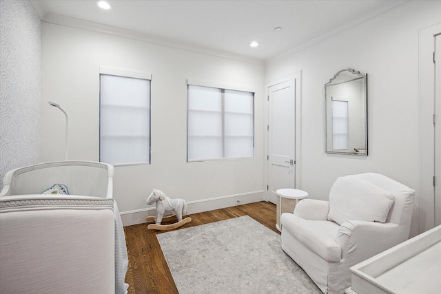 bedroom with ornamental molding, wood finished floors, baseboards, and recessed lighting
