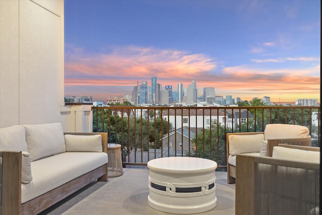 balcony featuring an outdoor living space and a skyline view