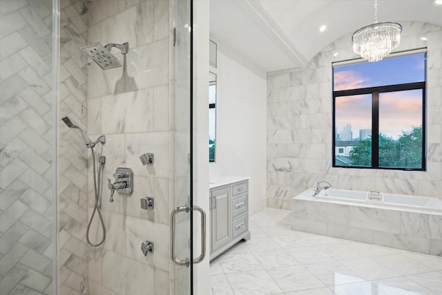 bathroom featuring a chandelier, a stall shower, a bath, and vanity
