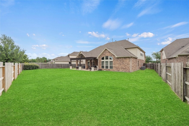 18814 Luby Creek Dr, Cypress, TX 77433 - rear view of property featuring brick siding, a patio, central air condition unit, and roof with shingles