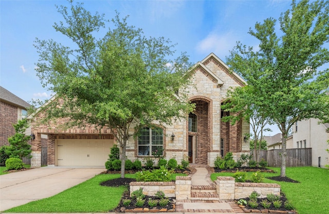 18814 Luby Creek Dr, Cypress, TX 77433 - view of front of house featuring brick siding, driveway, a garage, and stone siding