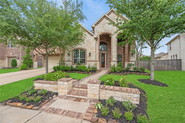 18814 Luby Creek Dr, Cypress, TX 77433 - french country home with stone siding, concrete driveway, and a garage