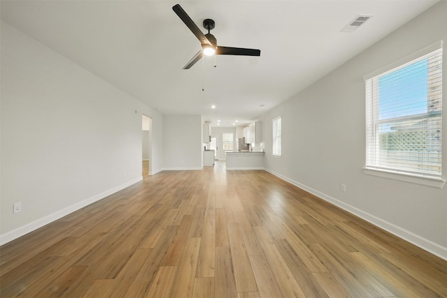 820 Dawn Redwood Ct, Conroe, TX 77304 - unfurnished living room featuring light wood finished floors, ceiling fan, baseboards, and recessed lighting
