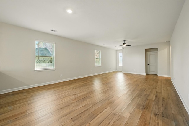 820 Dawn Redwood Ct, Conroe, TX 77304 - empty room featuring light wood-style floors, ceiling fan, and baseboards