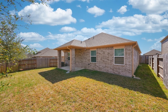 820 Dawn Redwood Ct, Conroe, TX 77304 - rear view of property featuring brick siding, a patio area, and roof with shingles