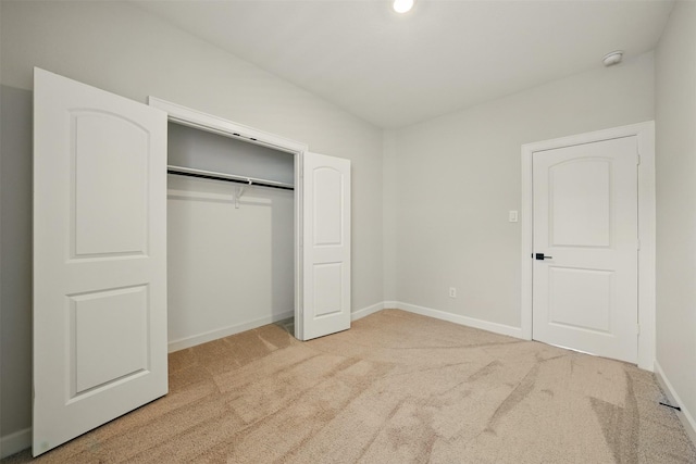 820 Dawn Redwood Ct, Conroe, TX 77304 - unfurnished bedroom featuring carpet flooring, baseboards, and a closet