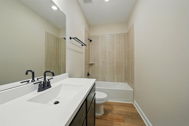 820 Dawn Redwood Ct, Conroe, TX 77304 - bathroom featuring toilet, wood finished floors, vanity,  shower combination, and baseboards