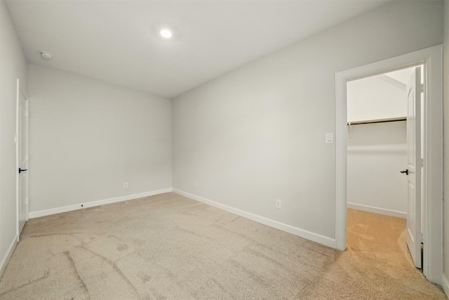 820 Dawn Redwood Ct, Conroe, TX 77304 - unfurnished bedroom with carpet floors, a spacious closet, baseboards, a closet, and recessed lighting