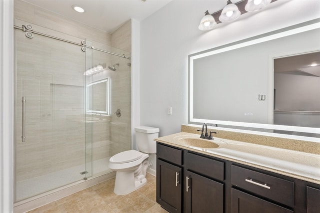 2642 Tacoma Springs Dr, Conroe, TX 77304 - bathroom featuring a stall shower, toilet, vanity, tile patterned floors, and baseboards