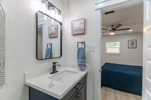 3618 Tamfield Dr, Houston, TX 77066 - bathroom featuring ceiling fan, wood finished floors, and vanity