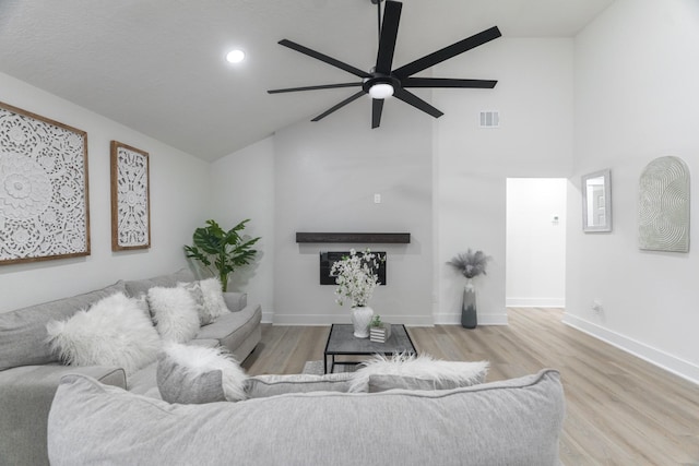3618 Tamfield Dr, Houston, TX 77066 - living area featuring a ceiling fan, high vaulted ceiling, wood finished floors, baseboards, and recessed lighting