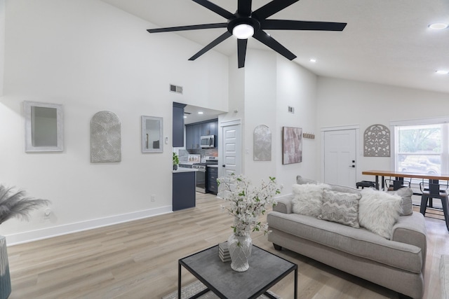 3618 Tamfield Dr, Houston, TX 77066 - living room featuring a ceiling fan, light wood-type flooring, baseboards, high vaulted ceiling, and recessed lighting