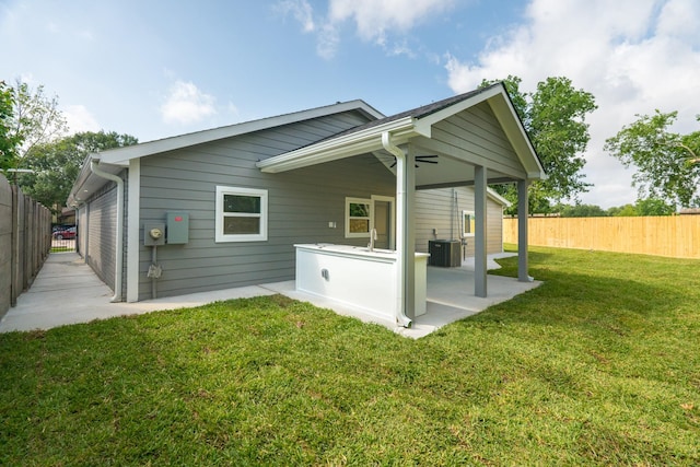 3618 Tamfield Dr, Houston, TX 77066 - back of property featuring a patio and central AC unit