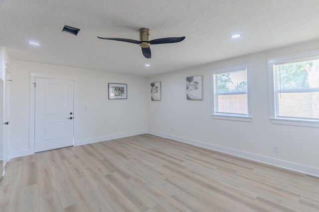 3618 Tamfield Dr, Houston, TX 77066 - unfurnished room featuring light wood finished floors, recessed lighting, ceiling fan, a textured ceiling, and baseboards
