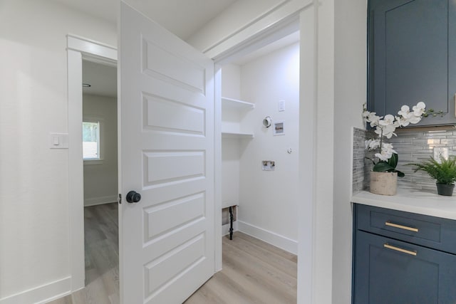 3618 Tamfield Dr, Houston, TX 77066 - laundry area with light wood finished floors, hookup for a washing machine, baseboards, and hookup for an electric dryer